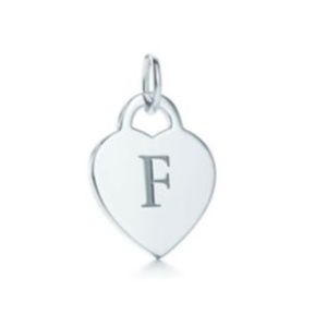 Tiffany & Co. sterling silver "F" heart charm